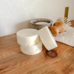 all natural dish soap bars stacked with a ramekin and scrub brush